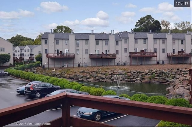 exterior space featuring a residential view and uncovered parking