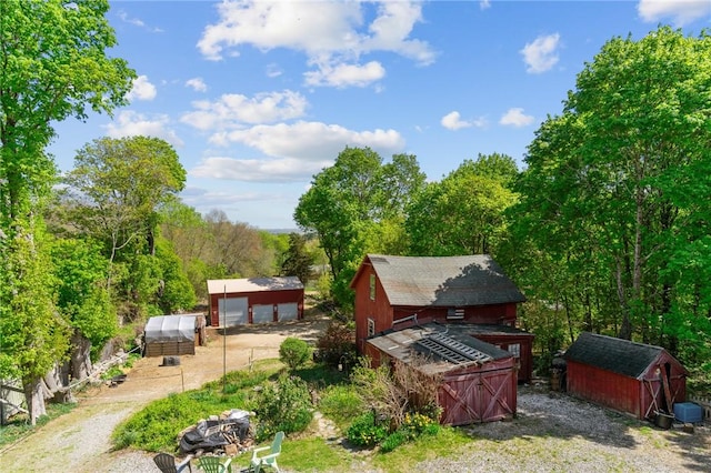 48 Highview Ave, Hopkinton, RI 02832 - back of property with an outbuilding, a storage unit, a garage, and a barn