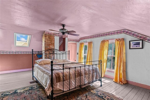 48 Highview Ave, Hopkinton, RI 02832 - bedroom featuring baseboards, hardwood / wood-style floors, vaulted ceiling, and a ceiling fan