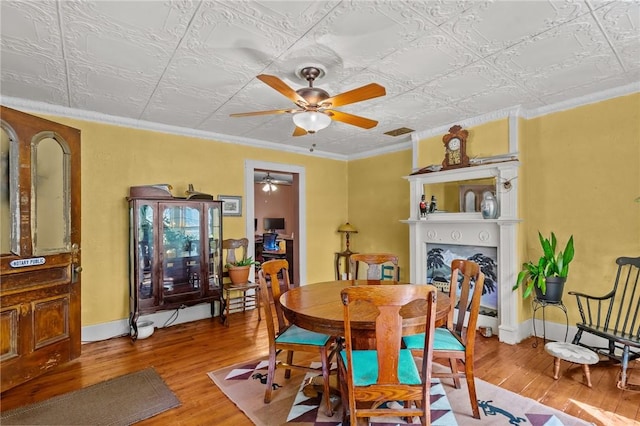 48 Highview Ave, Hopkinton, RI 02832 - dining area featuring wood-type flooring, ceiling fan, an ornate ceiling, and ornamental molding