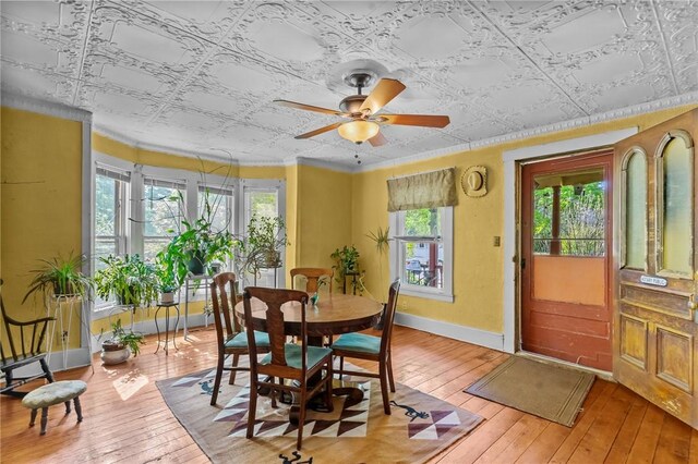 48 Highview Ave, Hopkinton, RI 02832 - dining room featuring an ornate ceiling, light wood-type flooring, a ceiling fan, baseboards, and crown molding