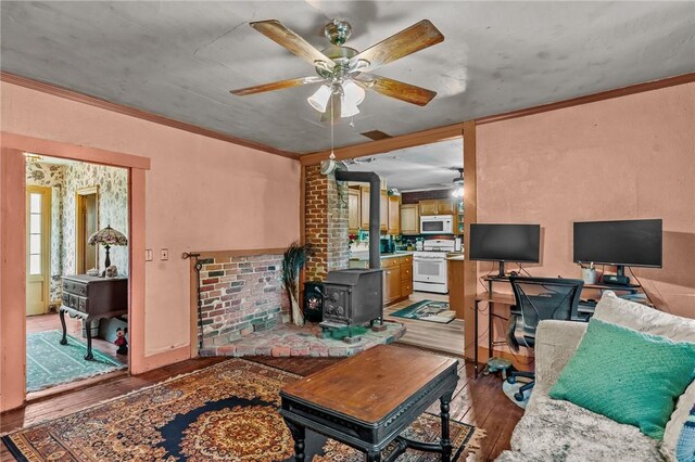 48 Highview Ave, Hopkinton, RI 02832 - living area with light wood-style floors, a wood stove, a ceiling fan, and crown molding