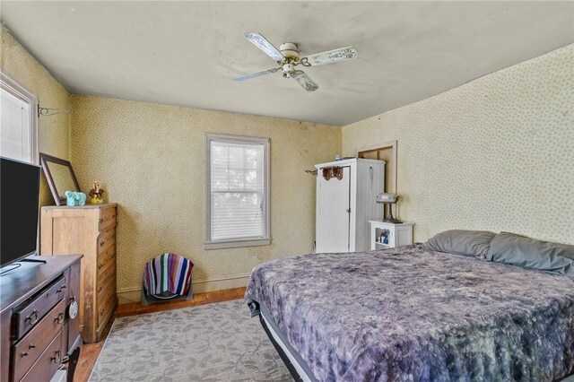 48 Highview Ave, Hopkinton, RI 02832 - bedroom with light wood-style floors, wallpapered walls, baseboards, and a ceiling fan