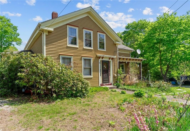 48 Highview Ave, Hopkinton, RI 02832 - back of house featuring a chimney