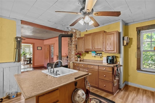 48 Highview Ave, Hopkinton, RI 02832 - kitchen featuring a sink, light wood-style flooring, brown cabinetry, light countertops, and ceiling fan