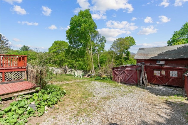48 Highview Ave, Hopkinton, RI 02832 - view of yard featuring an outdoor structure, fence, and a wooden deck