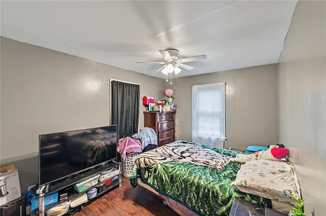 bedroom featuring a ceiling fan and wood finished floors