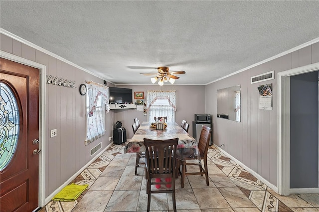 dining area featuring baseboards and ornamental molding