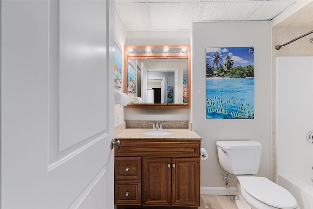 full bath featuring toilet, bathing tub / shower combination, and vanity