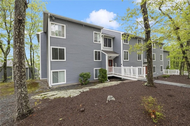 rear view of property with a deck