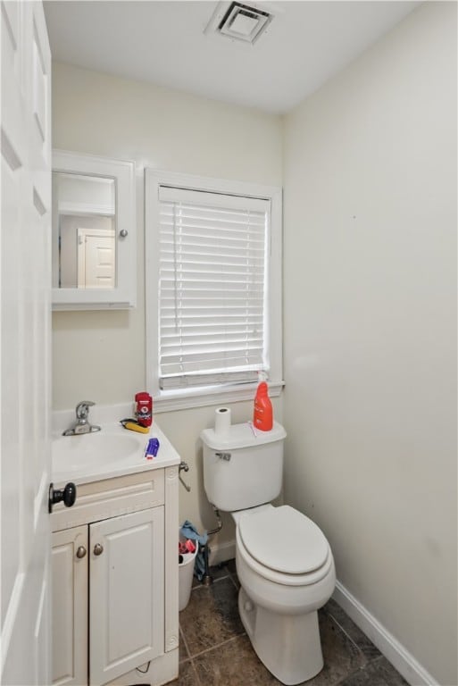 17 Grotto Ave Unit 1, Pawtucket, RI 02860 - bathroom with toilet, tile patterned floors, visible vents, baseboards, and vanity