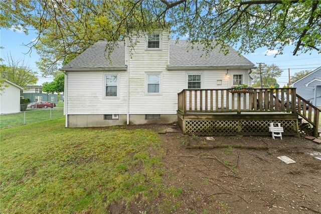 141 Burns St, Providence, RI 02904 - back of property featuring a lawn, a wooden deck, and roof with shingles