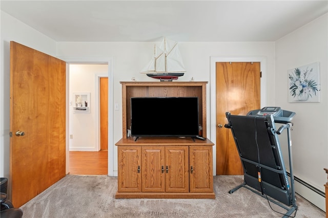 141 Burns St, Providence, RI 02904 - workout room with light colored carpet and a baseboard heating unit