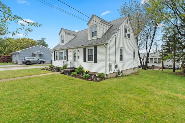 141 Burns St, Providence, RI 02904 - cape cod home featuring a shingled roof and a front yard