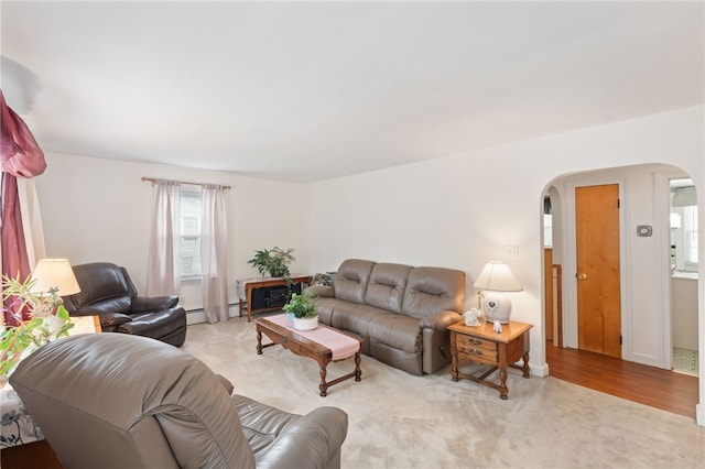 141 Burns St, Providence, RI 02904 - living area featuring light colored carpet and arched walkways