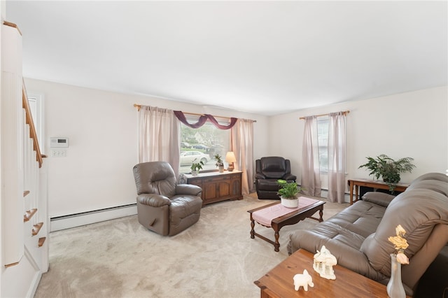 141 Burns St, Providence, RI 02904 - living area with light colored carpet, stairway, and a baseboard radiator