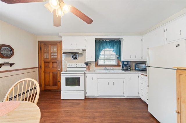 141 Burns St, Providence, RI 02904 - kitchen with a baseboard radiator, range hood, white appliances, a sink, and light countertops