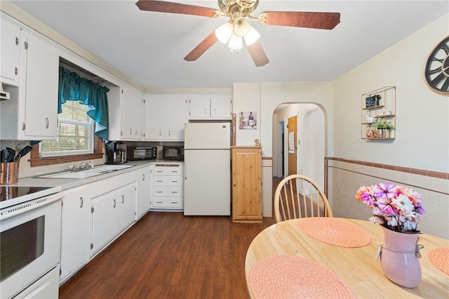 141 Burns St, Providence, RI 02904 - kitchen featuring white cabinets, dark wood-style flooring, a sink, and white appliances