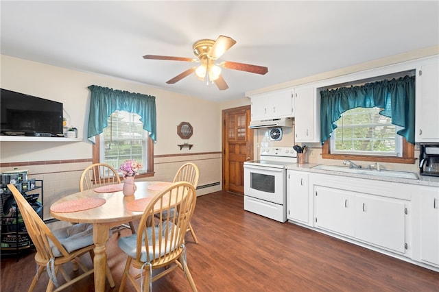 141 Burns St, Providence, RI 02904 - kitchen featuring under cabinet range hood, a sink, white electric range oven, a wainscoted wall, and light countertops
