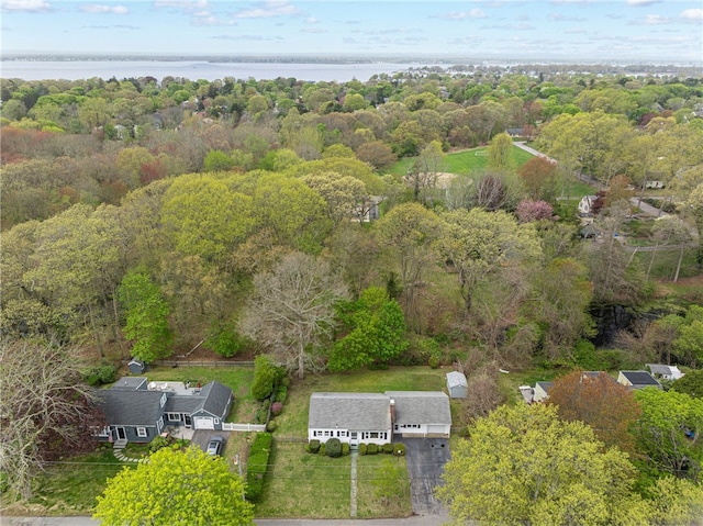 aerial view featuring a water view and a forest view