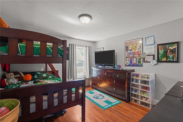 bedroom with wood finished floors
