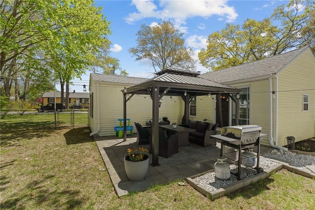 view of patio / terrace with an outdoor living space, a gazebo, and fence