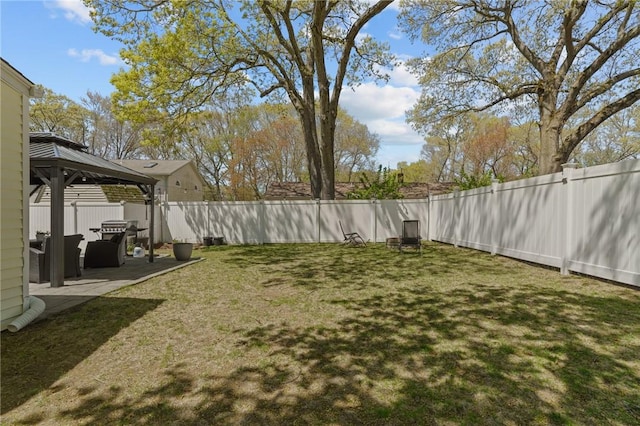 view of yard with a patio, a gazebo, and a fenced backyard