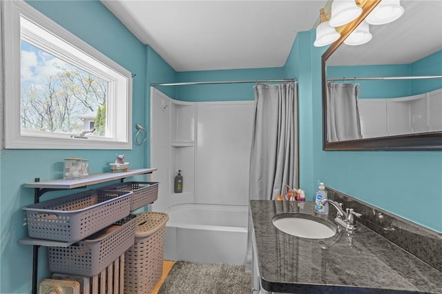 bathroom featuring vanity and shower / bathtub combination with curtain