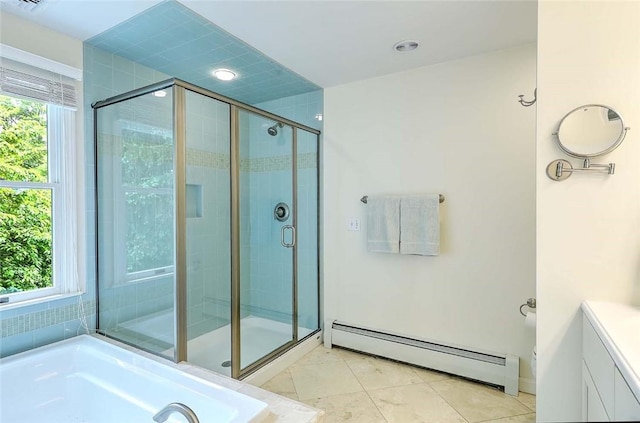 full bathroom with a baseboard heating unit, a stall shower, and a bath