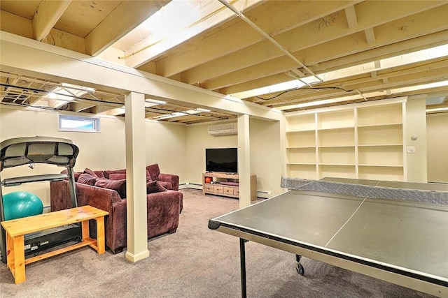 rec room with a wall unit AC, a baseboard heating unit, and carpet floors