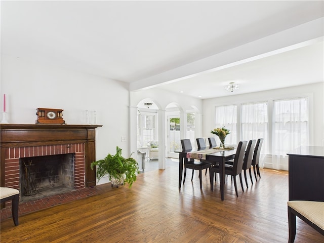 135 Cypress St, Providence, RI 02906 - dining space featuring wood finished floors and a brick fireplace