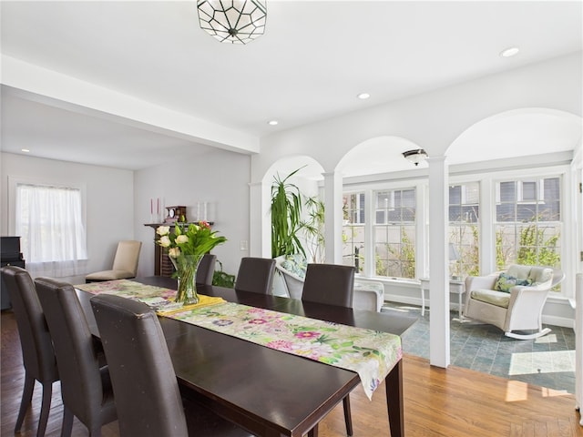 135 Cypress St, Providence, RI 02906 - dining room featuring arched walkways, recessed lighting, light wood-type flooring, and ornate columns