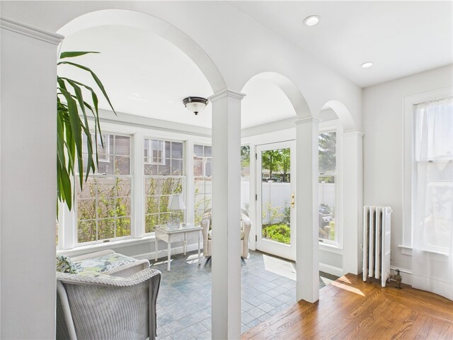135 Cypress St, Providence, RI 02906 - sunroom with radiator and arched walkways
