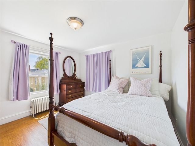 135 Cypress St, Providence, RI 02906 - bedroom featuring baseboards, radiator, and light wood finished floors