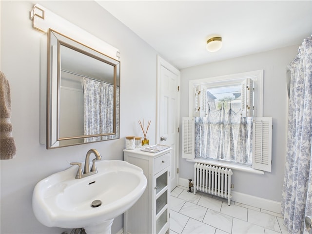 135 Cypress St, Providence, RI 02906 - full bathroom featuring marble finish floor, baseboards, a sink, and radiator heating unit