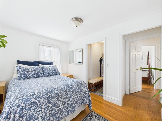 135 Cypress St, Providence, RI 02906 - bedroom featuring baseboards, crown molding, and wood finished floors