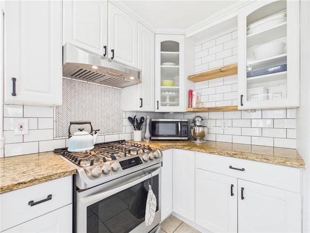 135 Cypress St, Providence, RI 02906 - kitchen with under cabinet range hood, glass insert cabinets, stainless steel appliances, and backsplash