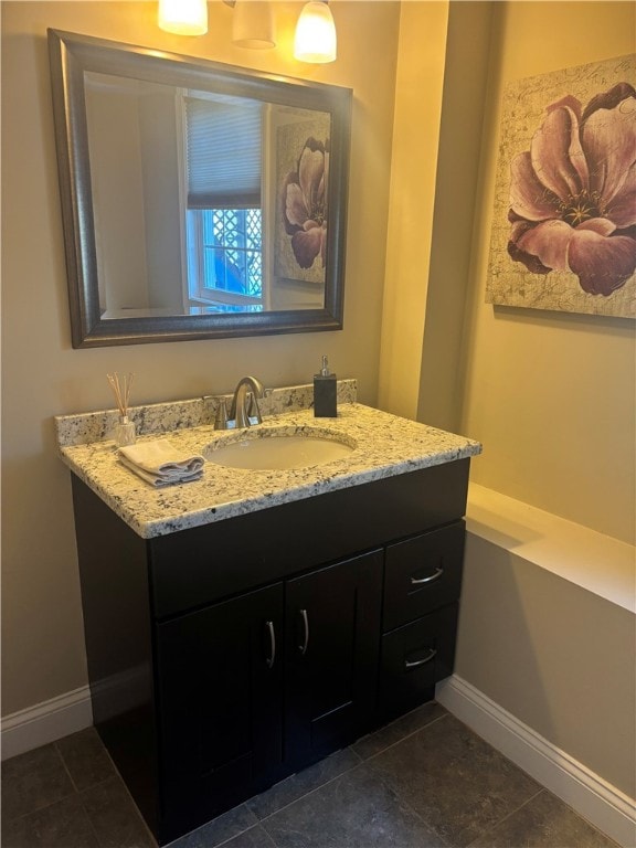 bathroom featuring vanity and baseboards