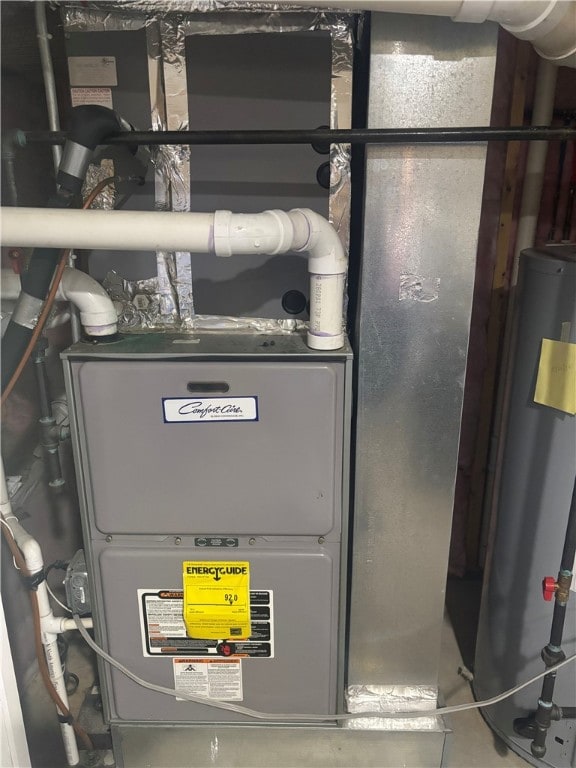 utility room featuring gas water heater