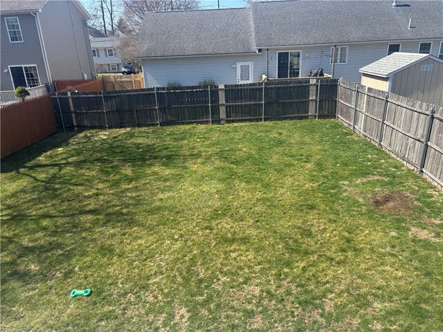 view of yard with a fenced backyard