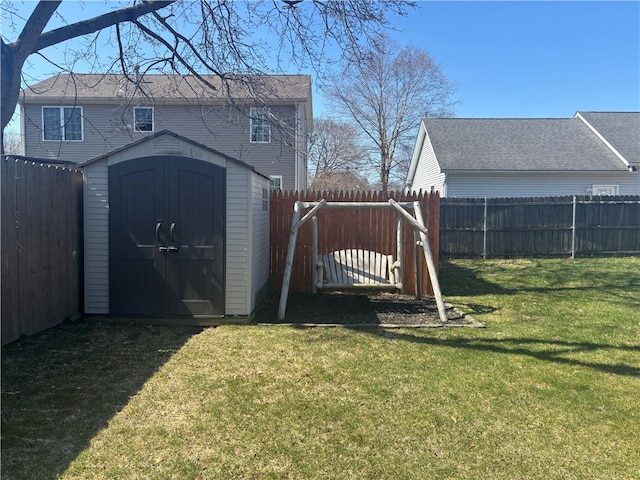 view of shed featuring a fenced backyard