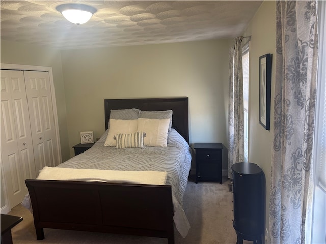 carpeted bedroom with a closet