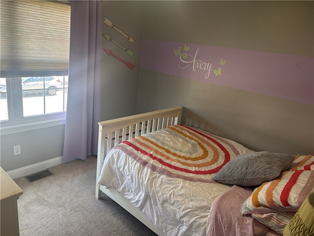 bedroom featuring carpet flooring, baseboards, and visible vents