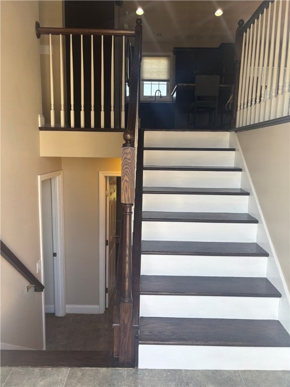stairs featuring baseboards