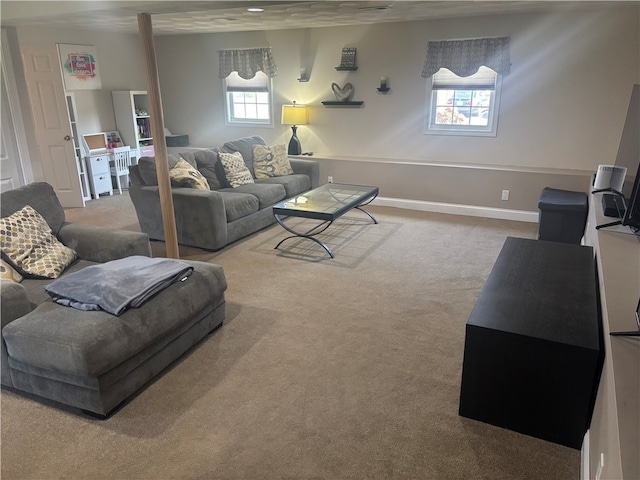 living room featuring carpet flooring and baseboards