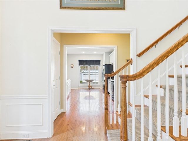 6 Yarmouth Cir S, Kingstown, RI 02879 - hall with light wood-style flooring and stairs