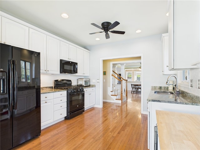 6 Yarmouth Cir S, Kingstown, RI 02879 - kitchen with a sink, ceiling fan, black appliances, and white cabinets