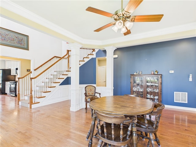 6 Yarmouth Cir S, Kingstown, RI 02879 - dining room featuring ceiling fan, visible vents, crown molding, light wood-type flooring, and ornate columns