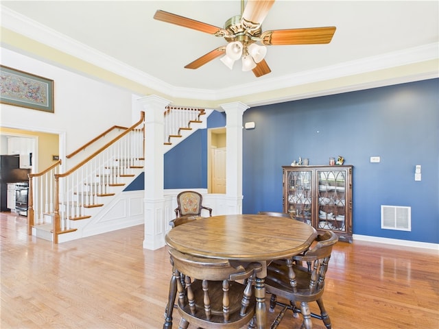 6 Yarmouth Cir S, Kingstown, RI 02879 - dining room with a ceiling fan, visible vents, wood finished floors, and decorative columns