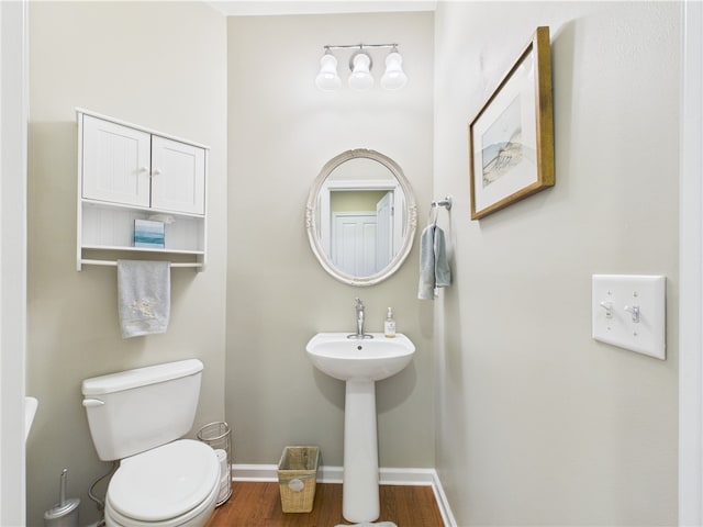 6 Yarmouth Cir S, Kingstown, RI 02879 - bathroom featuring a sink, toilet, baseboards, and wood finished floors
